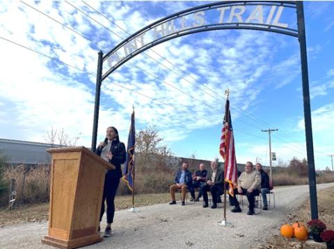 Rep. Sharice Davids speaking on the new federal RAISE grant at the Flint Hills Trail head.