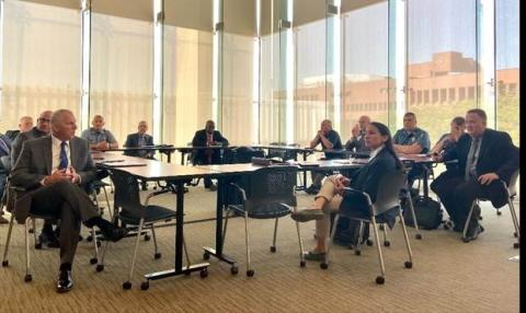 Rep. Sharice Davids with local, state, and federal law enforcement officers during her fentanyl summit in August.