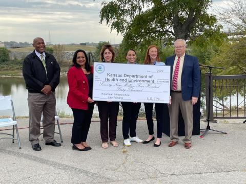 Rep. Sharice Davids helping to accept new funding for clean water in Kansas.