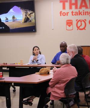 Rep. Sharice Davids speaks with furloughed federal workers about her efforts to end the shutdown.