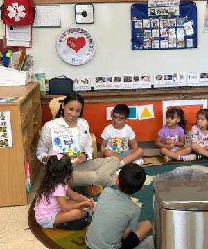 Rep. Sharice Davids reads to students at El Centro’s Head Start program.