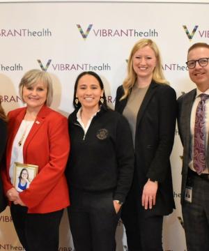 Rep. Sharice Davids and local health care leaders.