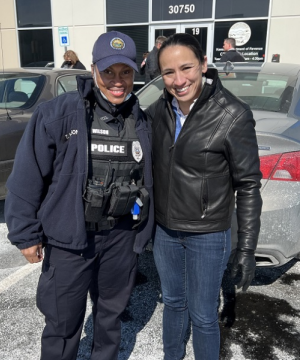 Rep. Sharice Davids with a local police officer at Johnson County Community College.