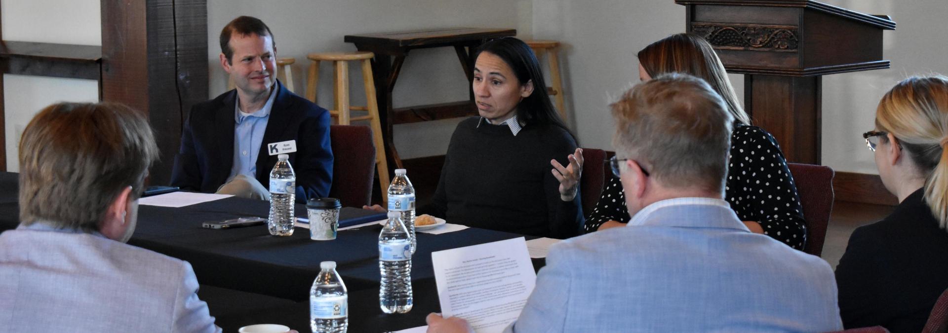 Rep. Sharice Davids and local housing and community development professionals discussing increasing Kansans’ access to safe, affordable housing 