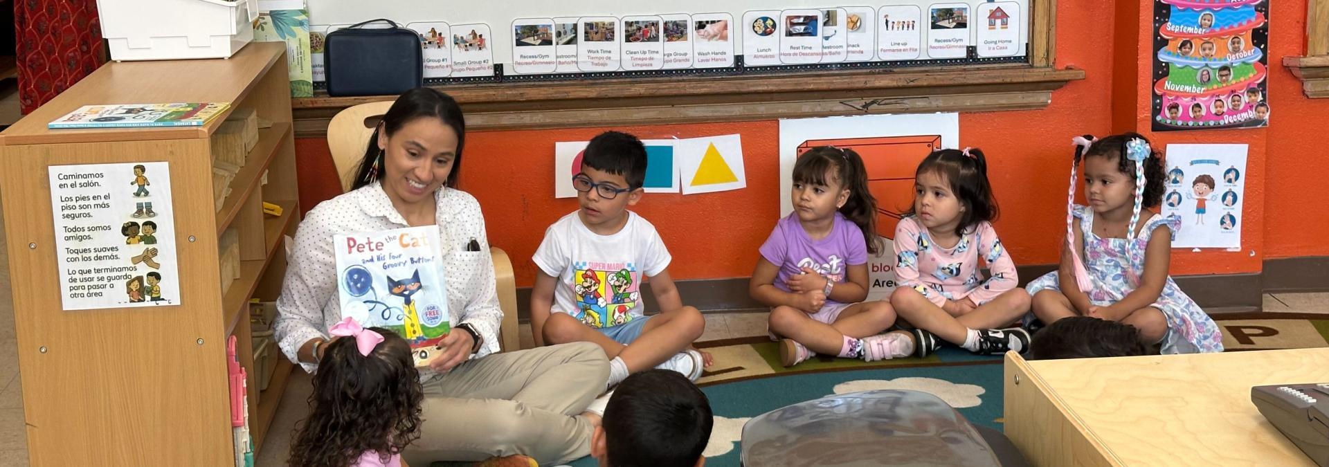 Rep. Sharice Davids reads to students at El Centro’s Head Start program.