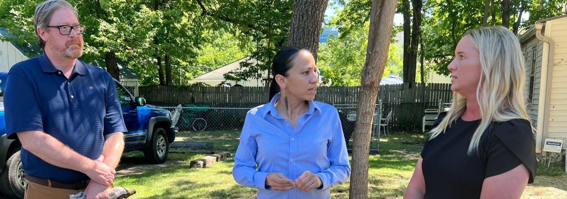 Rep. Sharice Davids with local officials after touring an Olathe lead pipe replacement site.