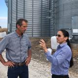 Representative Sharice Davids visits with Mike Barnes, owner of the Barnes Family Farm.