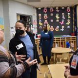 Rep. Sharice Davids speaking with Kimberly Sill, Director of Olathe Public Schools Head Start, and other staff.