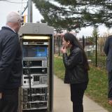 City Traffic Engineer Brian Shields showing Rep. Sharice Davids an outdated traffic control signal.