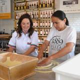 Rep. Sharice Davids working in the 1889 Pizza Napoletana kitchen.