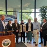 Rep. Sharice Davids alongside Governor Kelly, KDOT Secretary Lorenz, and Miami County Officials.