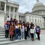 Group of people in front of the US Capitol Building