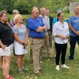 Sharice Davids standing outdoors with group of local leaders