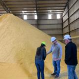 Rep. Davids, Bill Pracht, and Greg Krissek discuss crops produced by local farmers that are converted to ethanol.