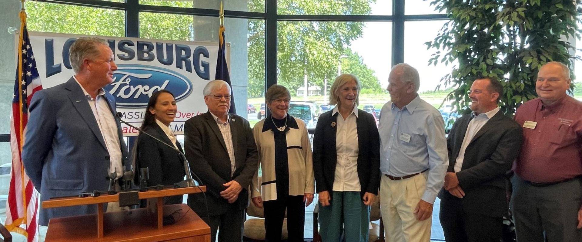Rep. Sharice Davids alongside Governor Kelly, KDOT Secretary Lorenz, and Miami County Officials.