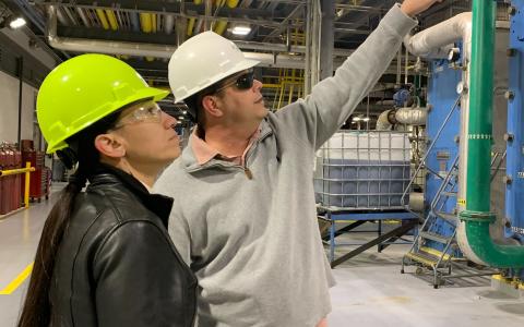 Rep. Davids and Bill Pracht inside the East Kansas Agri Energy ethanol production plant.