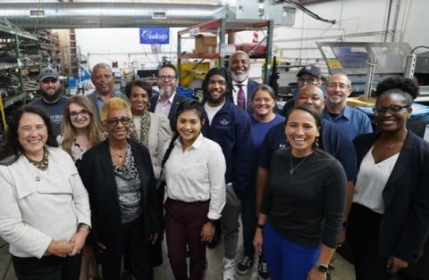 Rep. Davids with employees at a small business in the Kansas Third District.