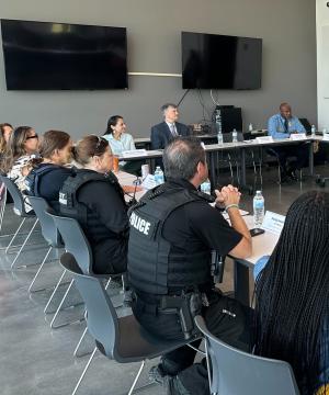 Rep. Sharice Davids speaking with local law enforcement, public health experts, and city officials during Mental Health Awareness Month.