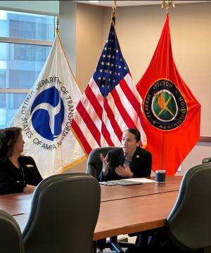 Representative Sharice Davids speaks with aviation staff at the FAA’s Central Region Headquarters.